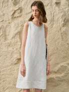 Sleeveless Linen Lyocell blend dress in relaxed A-line silhouette with hand-stitched neckline detail