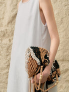 White sleeveless linen lyocell blend shift dress with relaxed A-line silhouette and round neckline