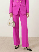 Double-breasted blazer with gold lion-head buttons and wide-leg trousers co-ord set in structured suiting fabric