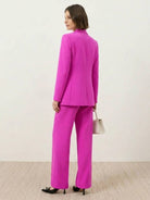 Structured double-breasted blazer with gold lion-head buttons and wide-leg trousers co-ord set
