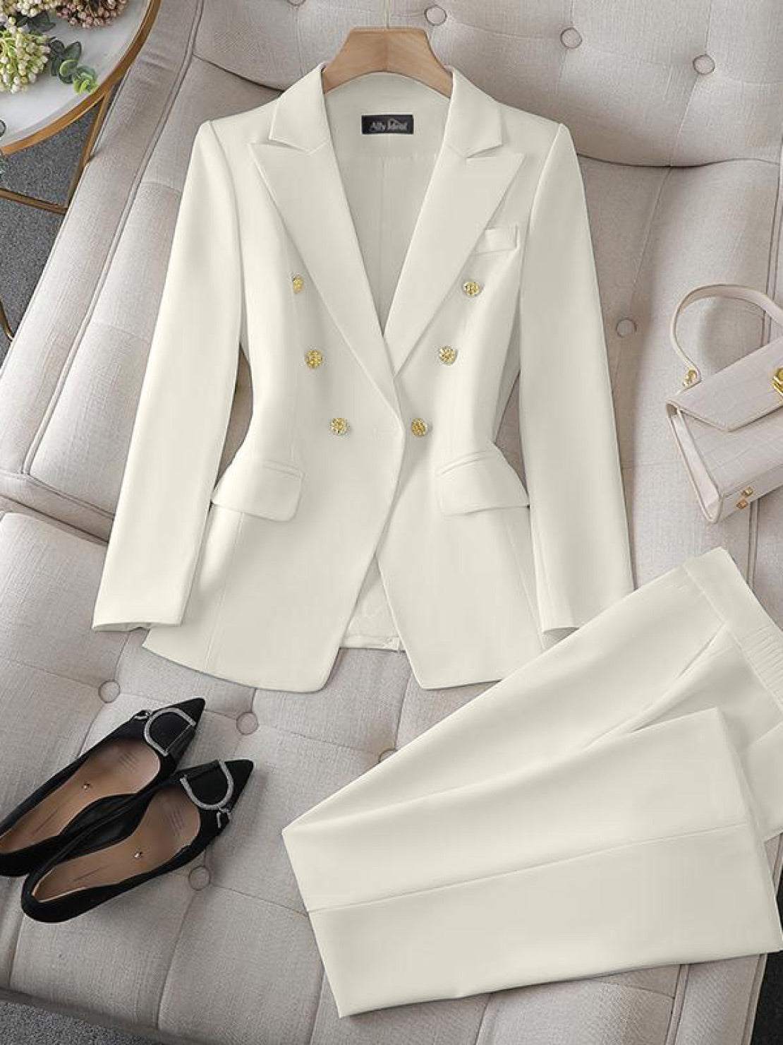 Double-breasted blazer with gold lion-head buttons and wide-leg trousers co-ord set