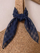 Lightweight 100% linen neck scarf with checkered pattern and natural rolled edges