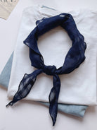 Lightweight 100% linen neck scarf with checkered pattern and natural rolled edges