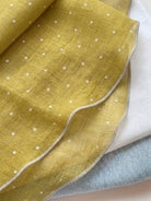 100% linen neck scarf with lightweight breathable fabric and timeless checkered pattern