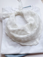 Lightweight 100% linen neck scarf with checkered pattern and natural rolled edges for versatile styling