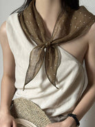 Lightweight 100% linen neck scarf with timeless checkered pattern and natural rolled edges for versatile styling