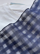 Lightweight 100% linen neck scarf with timeless checkered pattern and natural rolled edges