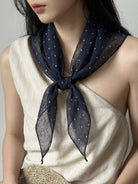 Lightweight 100% linen neck scarf with timeless checkered pattern and natural rolled edges