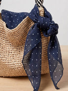Lightweight 100% linen neck scarf with checkered pattern and natural rolled edges for versatile styling