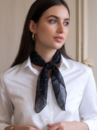 Lightweight 100% linen neck scarf with checkered pattern and natural rolled edges for versatile styling