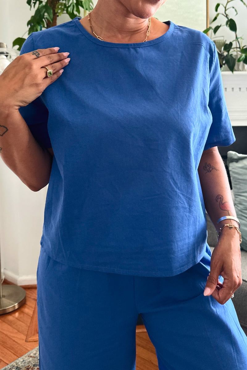 woman wearing Breezy Meadow two-piece set with soft-tailored top and wide-leg trousers in relaxed meadow setting