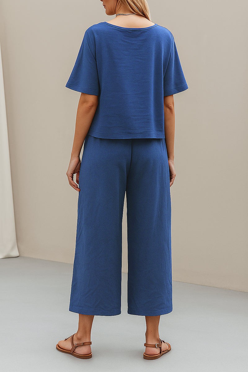 woman wearing Breezy Meadow Two-Piece Set with relaxed top and wide-leg trousers in light polyester fabric