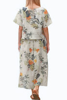 woman wearing Breezy Meadow Two-Piece Set with relaxed top and wide-leg trousers in light fabric