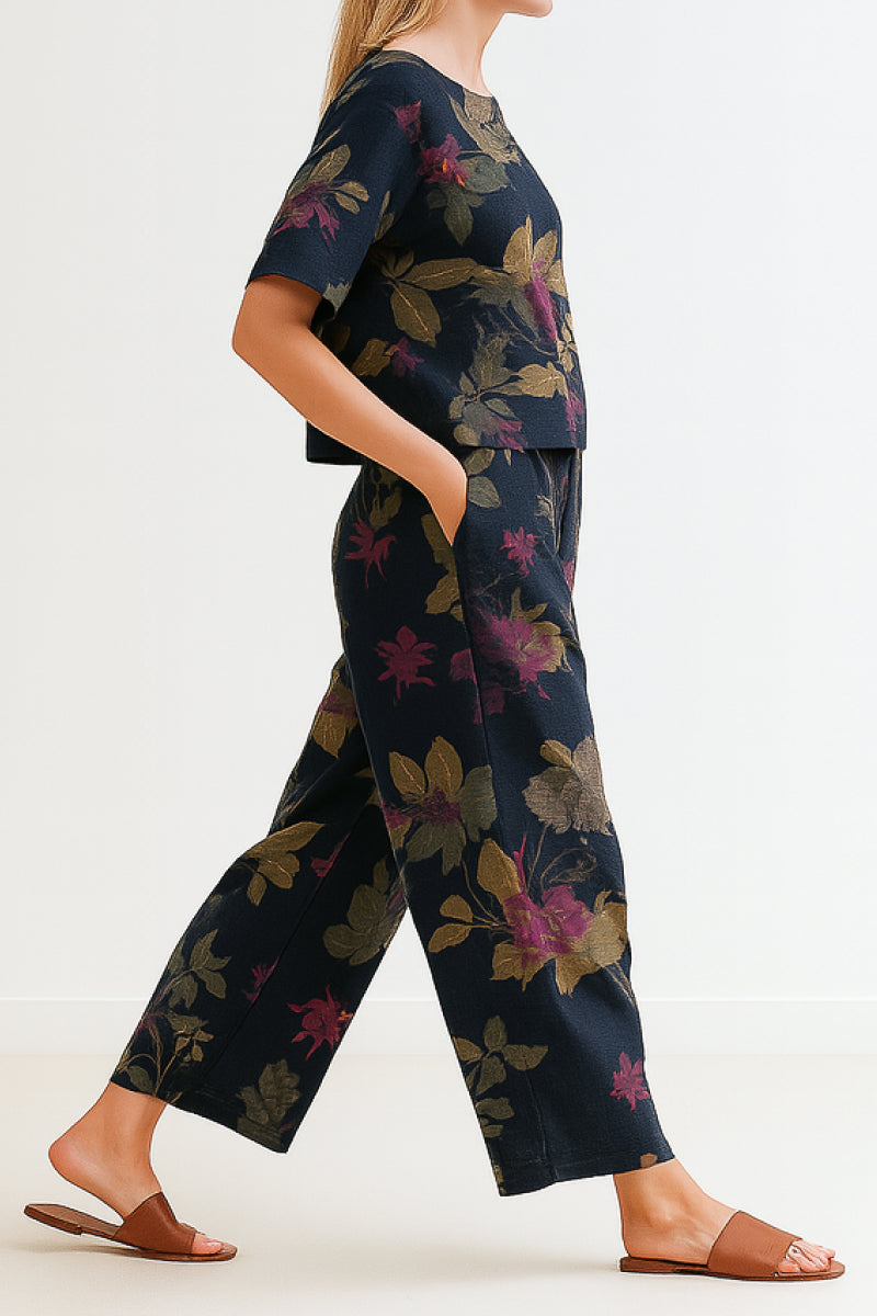 woman wearing Breezy Meadow two-piece set with relaxed top and wide-leg trousers outdoors