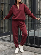 cotton-blended two-piece tracksuit with zip-up collar and relaxed fit pants