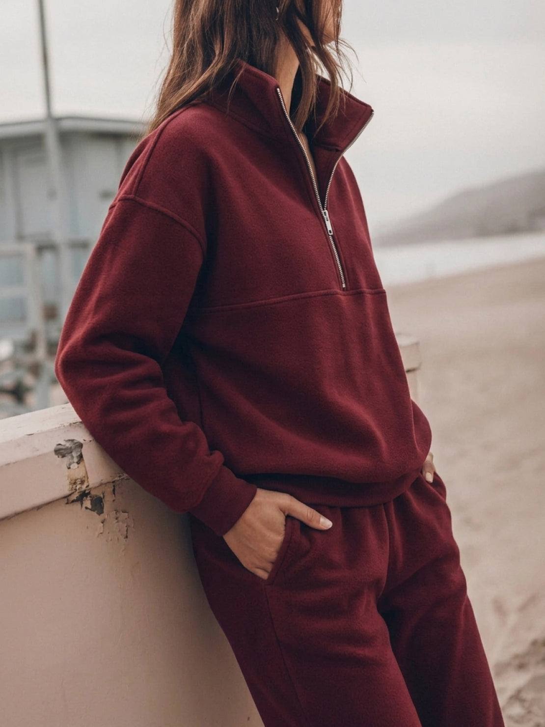 Cotton-blended two-piece tracksuit with high collar, zip front, and straight-leg pants