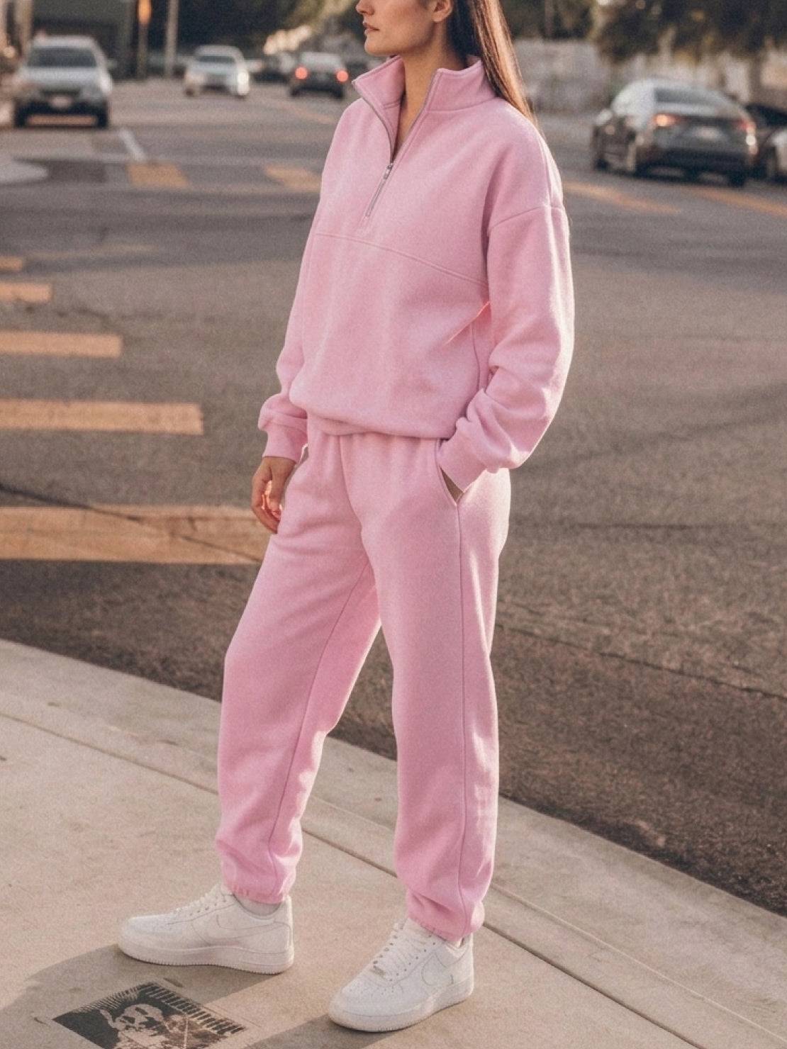 Cotton-blended two-piece tracksuit with high collar, zip-front top, and straight-leg pants
