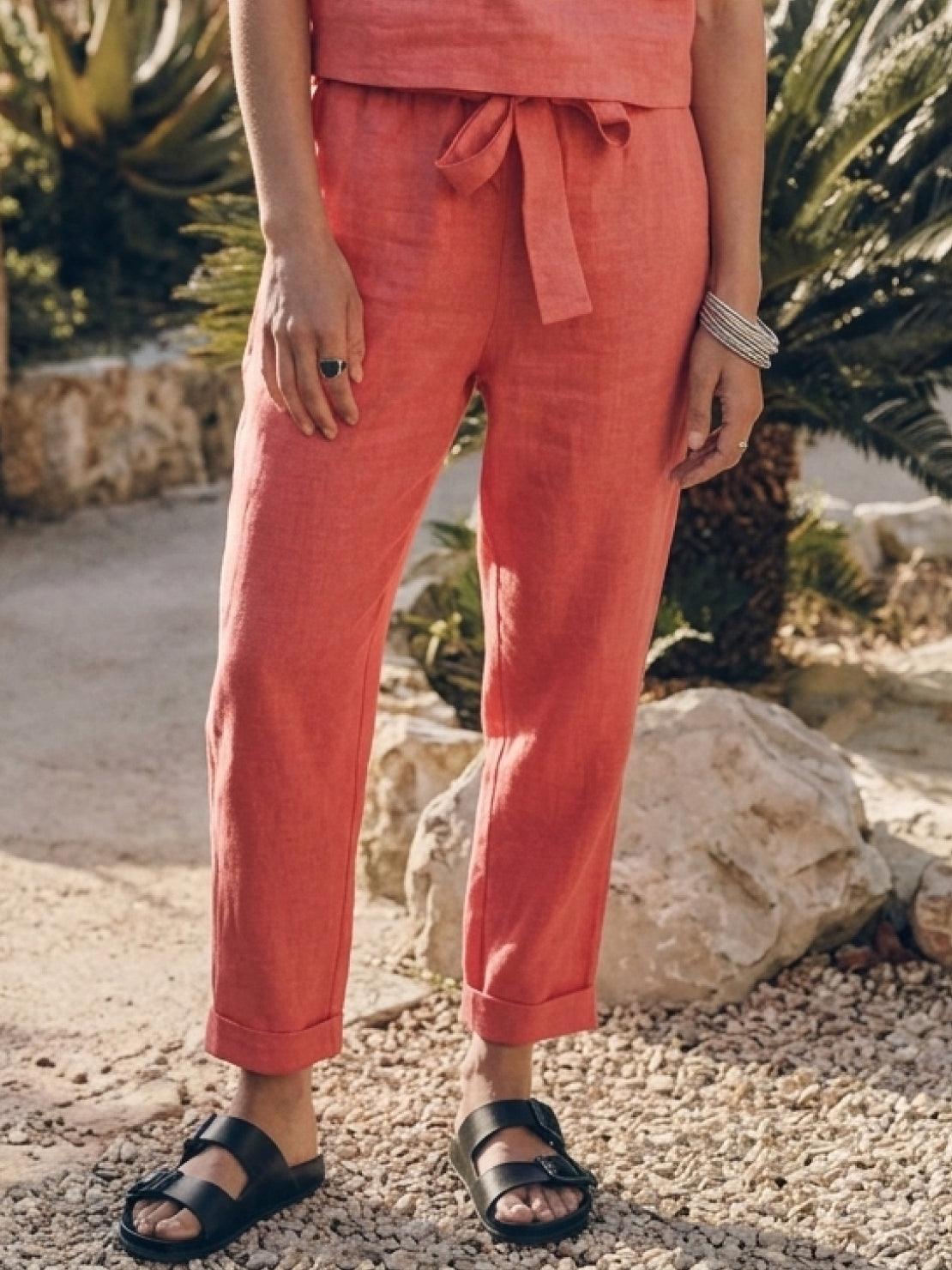 woman wearing relaxed cotton linen set with short sleeve top and straight-leg pants in monochrome color