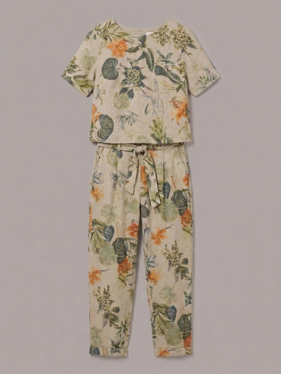 Woman wearing a breathable cotton linen set with relaxed short-sleeve top and straight-leg pants in monochrome tones.