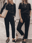 Cotton-linen set three-piece capsule outfit with relaxed short-sleeve top and straight-leg pants in monochrome tones