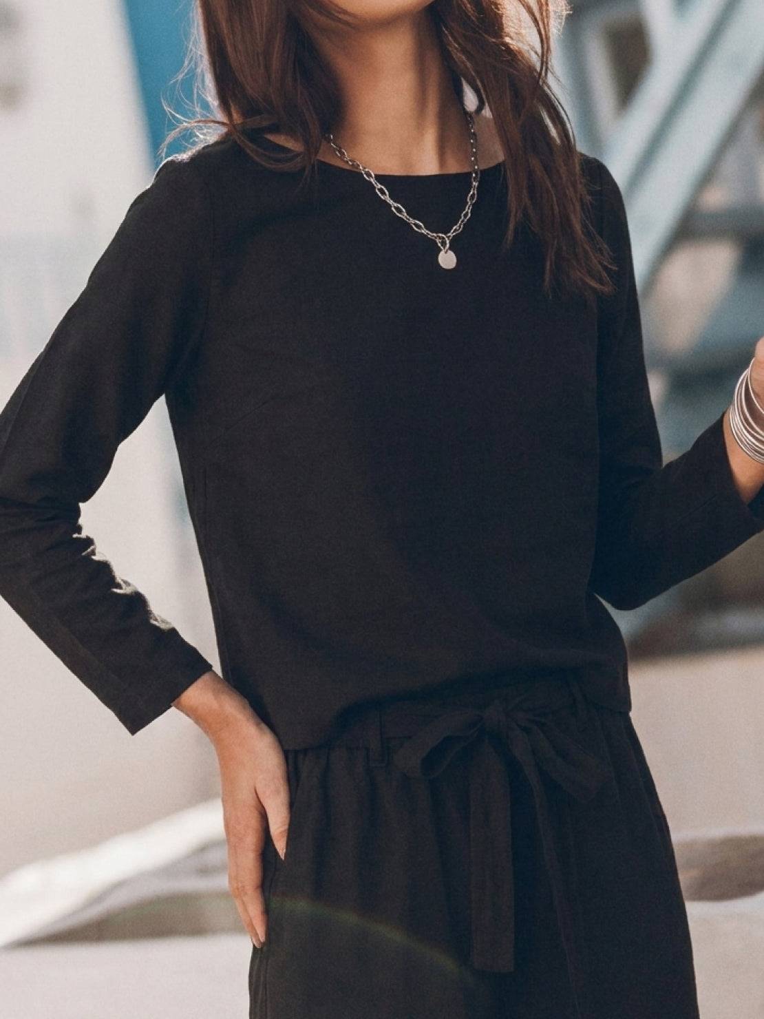 woman wearing cotton-linen monochrome relaxed longline top and wide-leg pants set