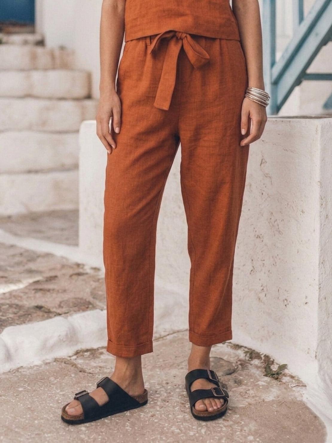 woman wearing cotton-linen monochrome relaxed longline top and wide-leg pants set