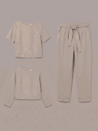 woman wearing relaxed cotton-linen set with short-sleeve top and straight-leg pants in monochrome tone