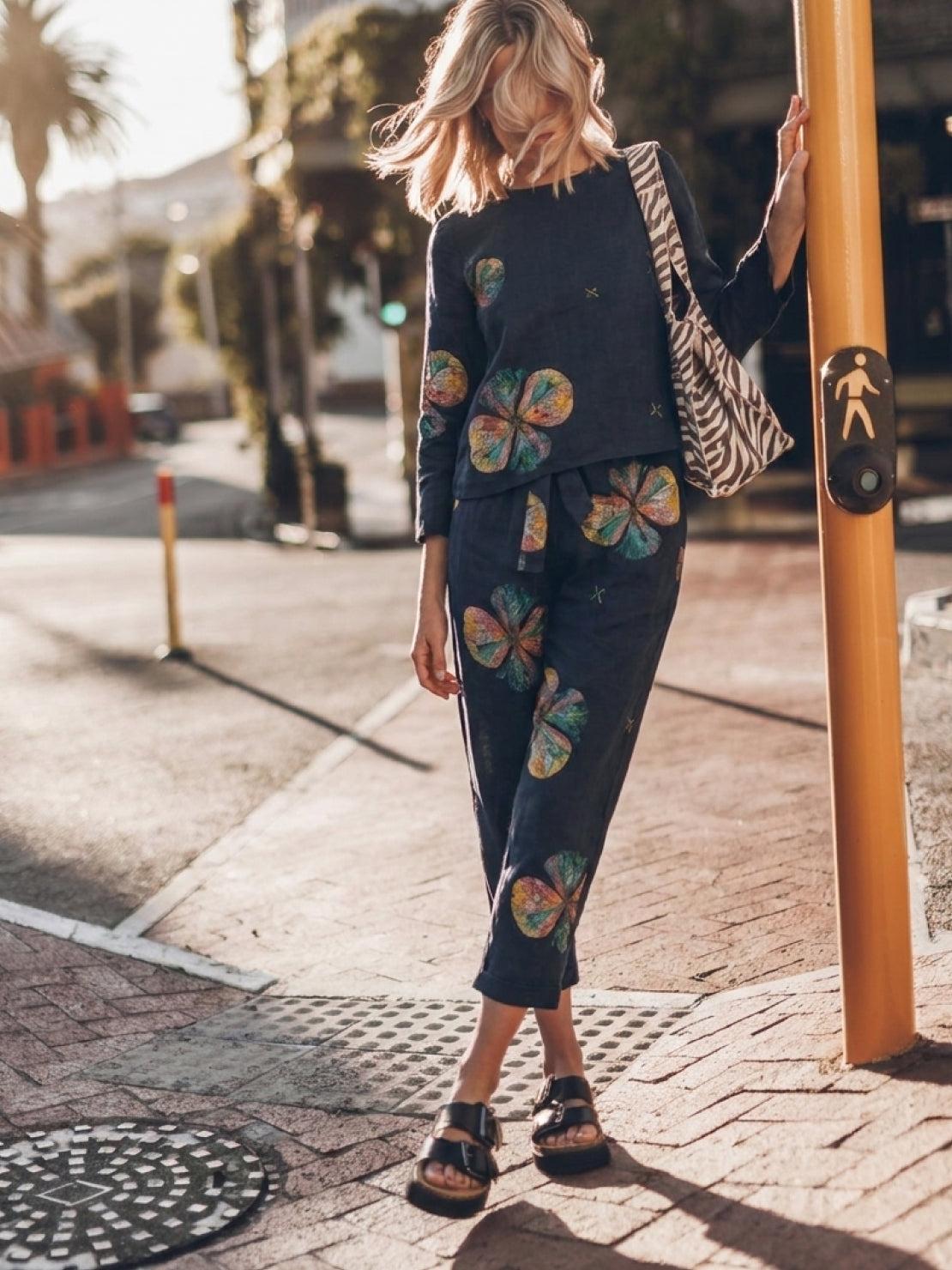 Woman wearing cotton-linen monochrome relaxed longline top and wide-leg pants set