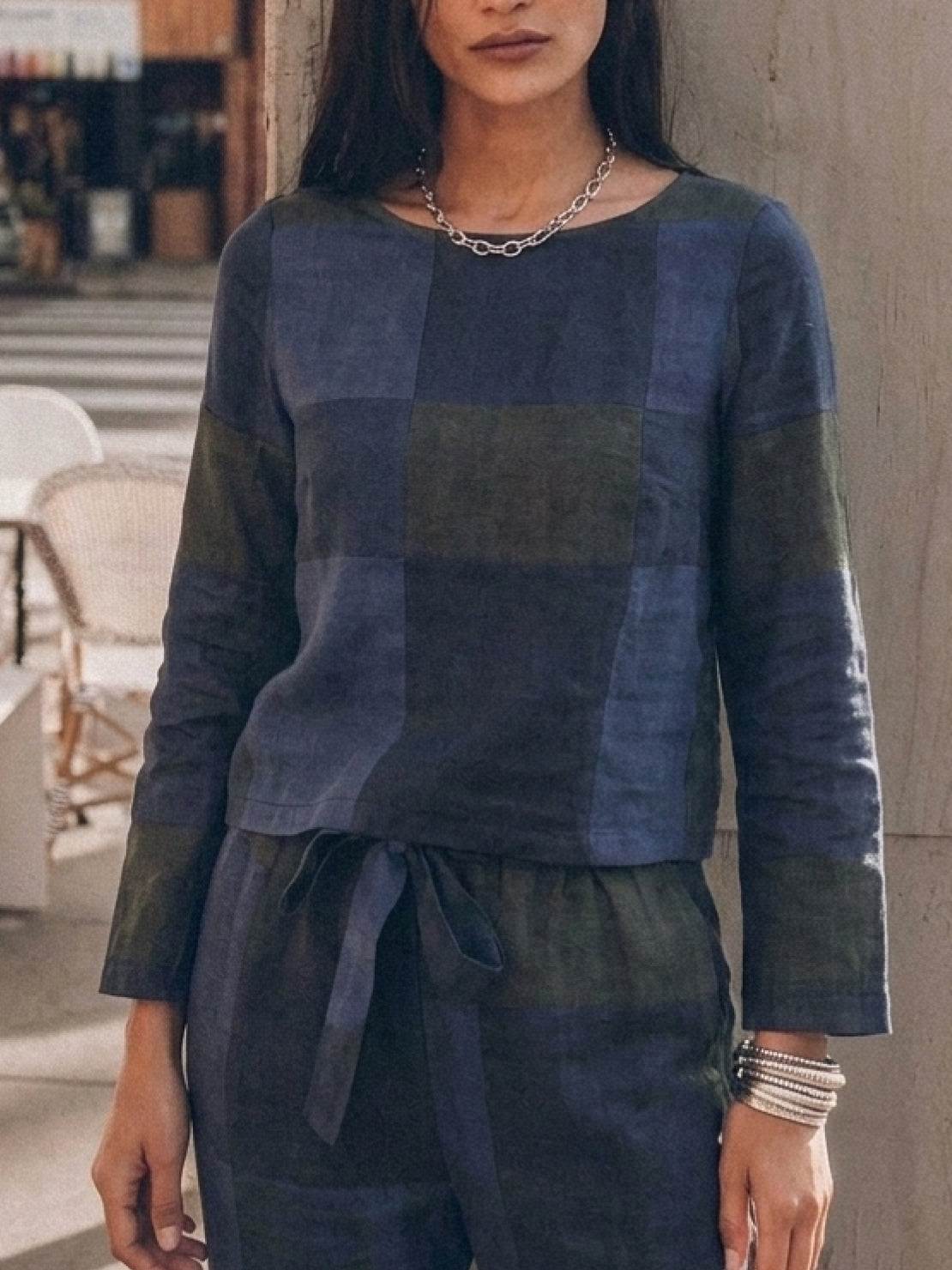 Woman wearing relaxed cotton-linen monochrome capsule outfit with longline top and wide-leg pants