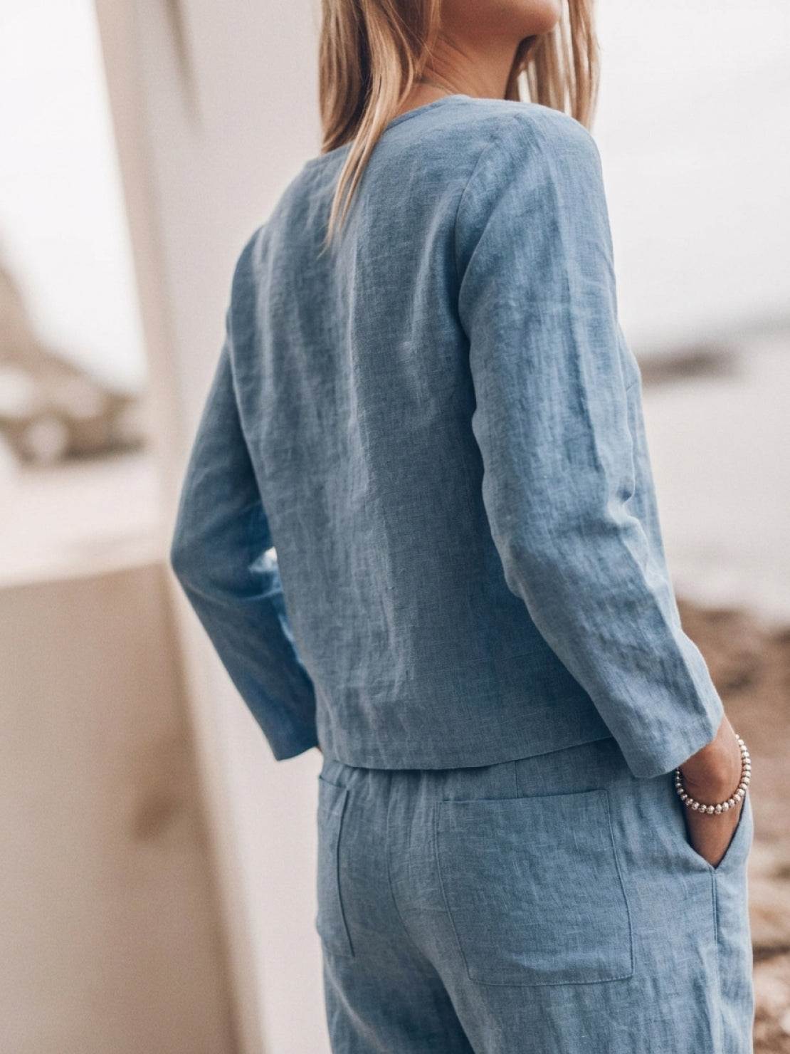 Model wearing relaxed cotton-linen monochrome longline top and wide-leg pants set