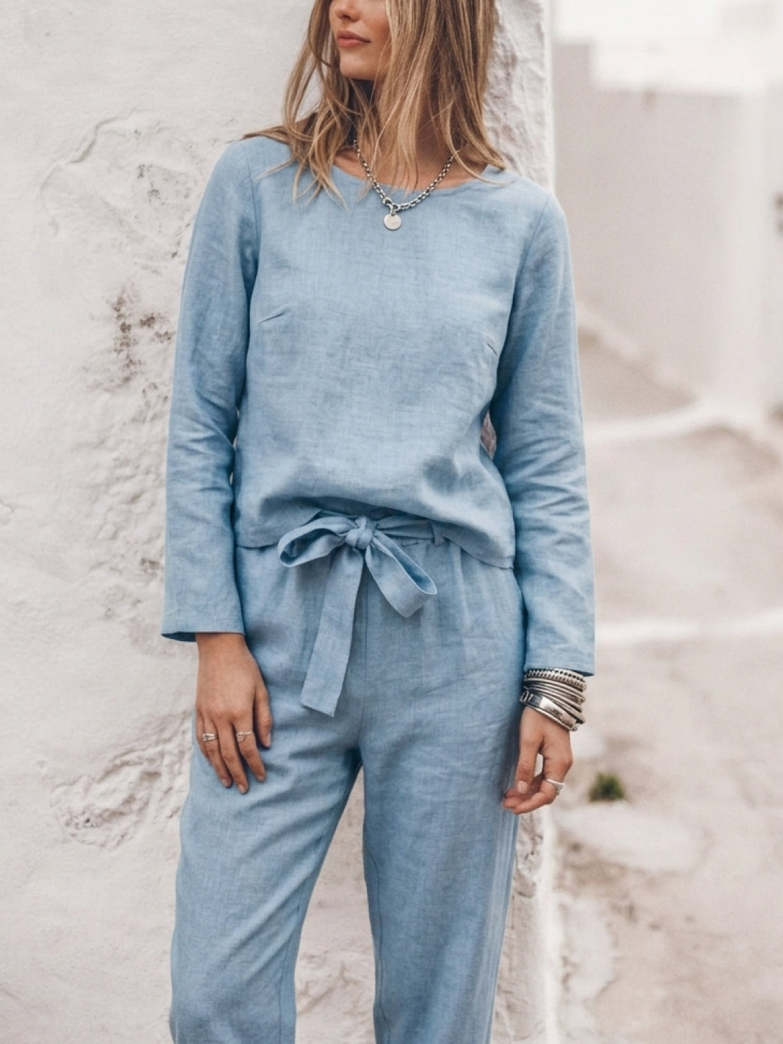 Woman wearing cotton-linen monochrome relaxed longline top and wide-leg pants set