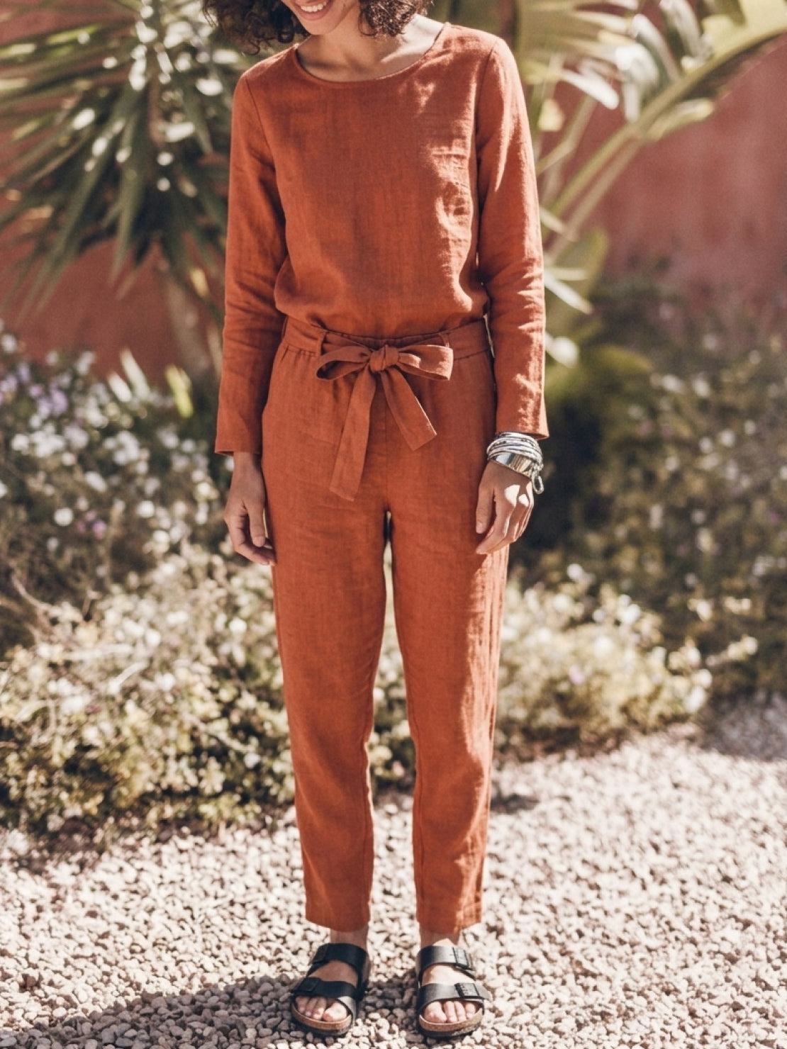 woman wearing cotton-linen monochrome relaxed longline top and wide-leg pants set