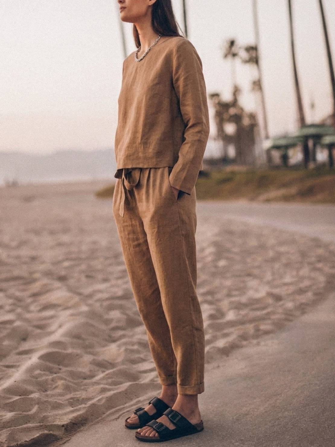 Woman wearing a cotton-linen monochrome relaxed longline top and wide-leg pants set