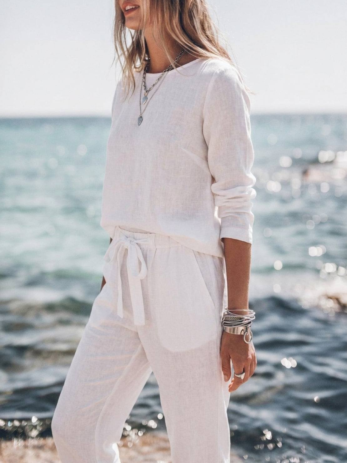 Woman wearing cotton-linen monochrome relaxed longline top and wide-leg pants set
