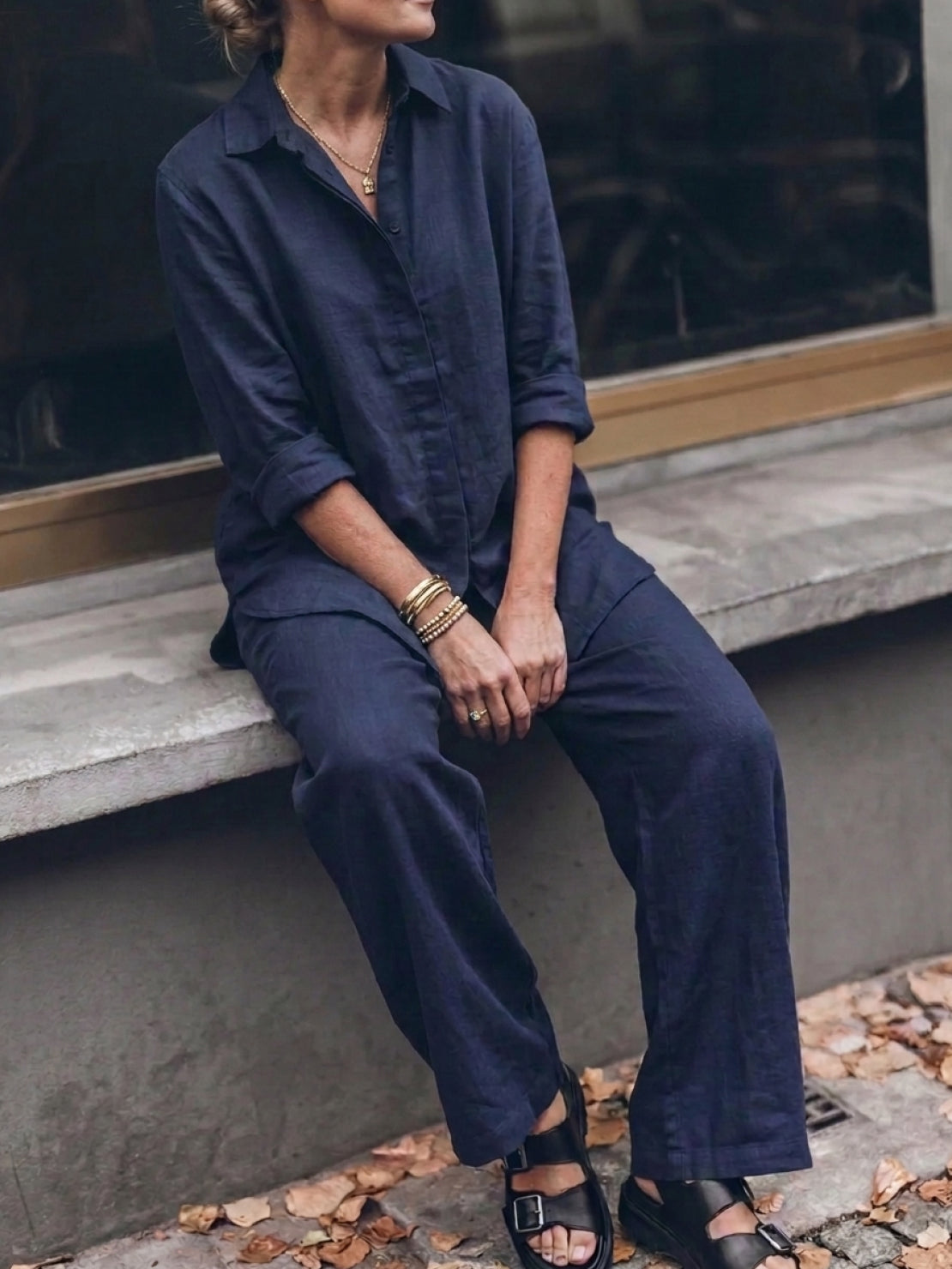 Woman wearing oversized 100% cotton shirt and wide-leg pants co-ord set, relaxed and breathable style