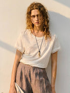 100% linen rolled cuff tee with relaxed scoop neckline and contrast inner lining