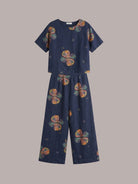 woman wearing soft-tailored loose fit co-ord set with wide-leg cotton trousers in natural light
