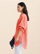 Oversized linen shirt in breathable cotton-linen blend with relaxed fit and back pleat detailing