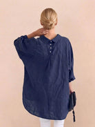 Oversized linen shirt in breathable cotton-linen blend with relaxed fit and button back detailing