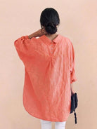 Oversized linen shirt in breathable cotton-linen blend with relaxed fit and buttoned back pleats