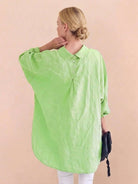 oversized linen shirt in breathable cotton-linen blend with relaxed fit and button back detailing
