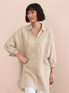 Oversized linen shirt made of breathable cotton-linen blend with relaxed fit and button back details