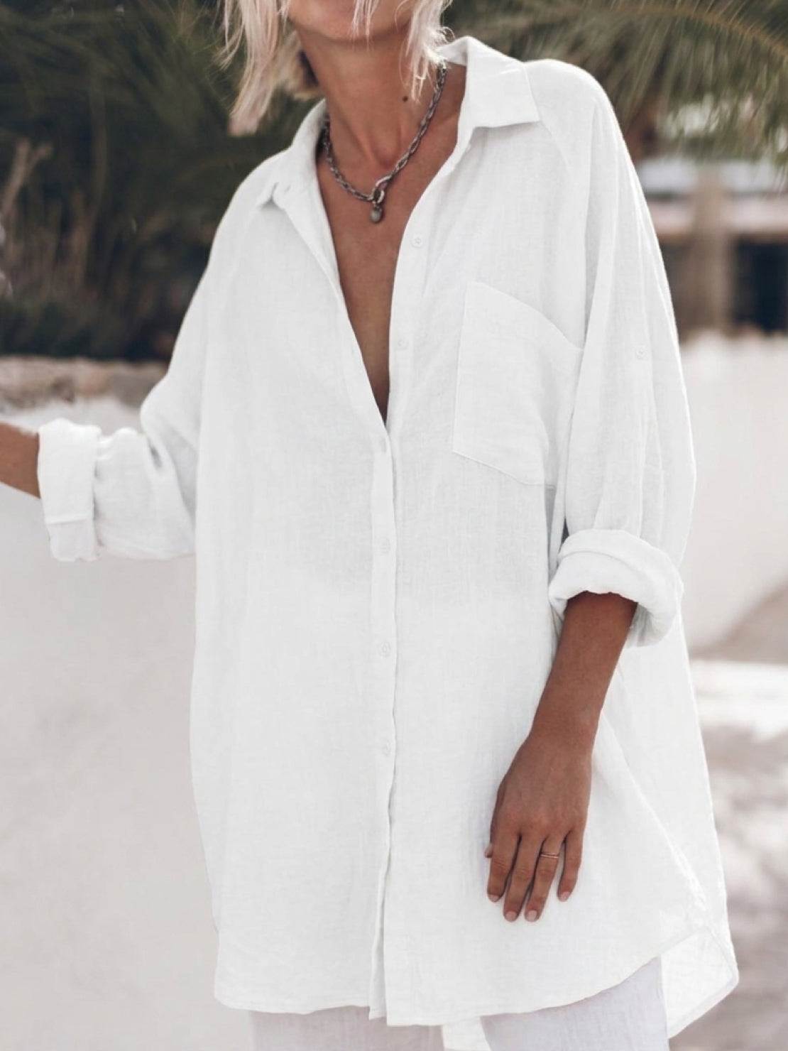 Oversized 100% cotton linen shirt with relaxed fit, dropped shoulders, and signature back pleat detail