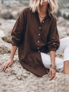oversized relaxed cotton linen shirt with dropped shoulders and signature back-pleat detail