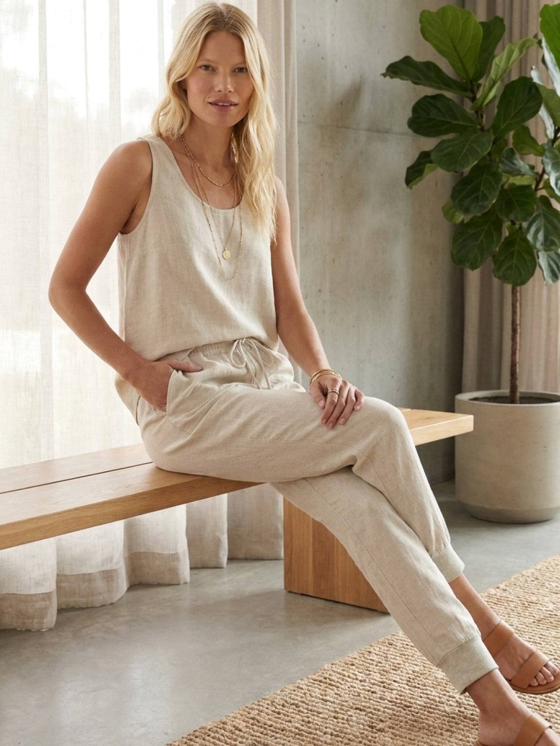 woman wearing relaxed chic elastic ankles pants in casual stylish pose