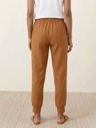 Woman wearing relaxed chic elastic ankle pants with a stylish casual outfit