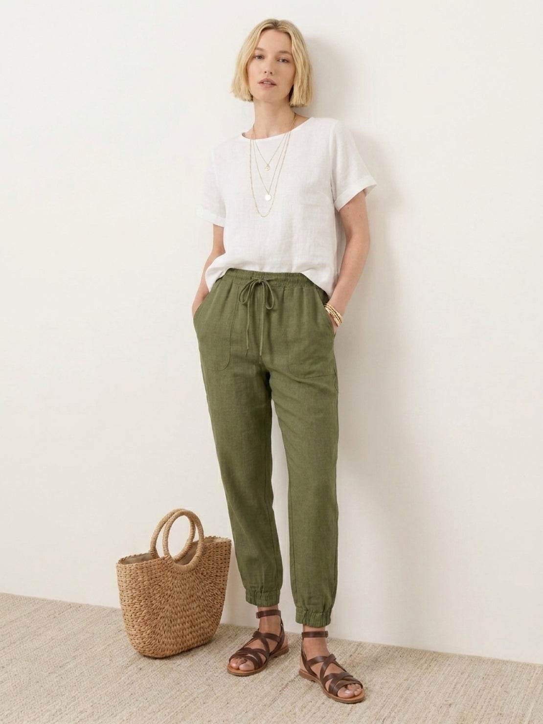 Woman wearing relaxed chic elastic ankles pants with a comfortable fit and stylish design