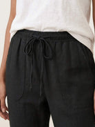 Woman wearing relaxed chic elastic ankles pants styled for casual comfort and elegance