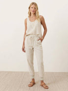 Woman wearing relaxed chic elastic ankles pants styled for comfort and everyday elegance