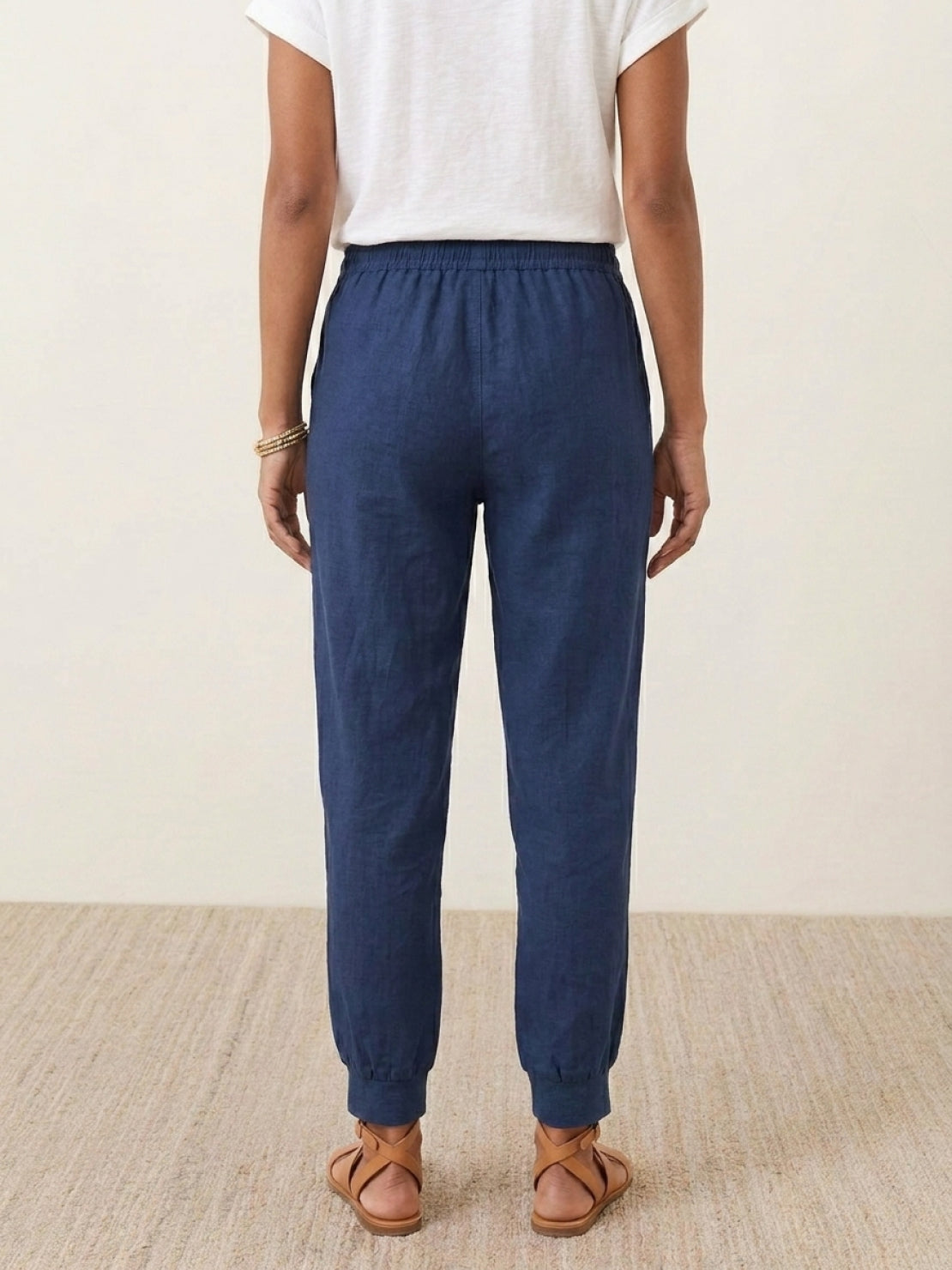 Woman wearing relaxed chic elastic ankles pants with a comfortable and flattering fit